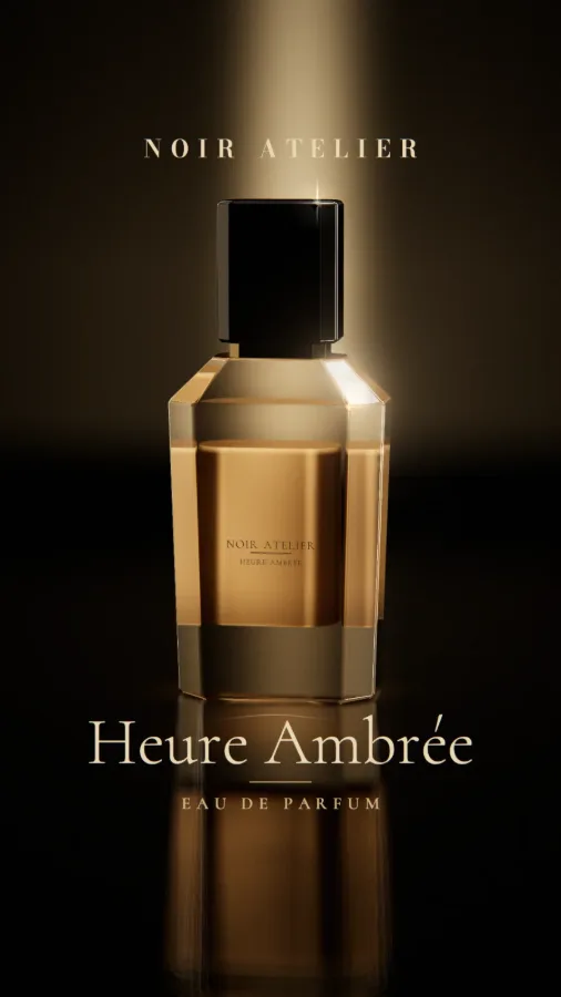 Heure Ambrée: a cut-glass bottle lit amber against black.